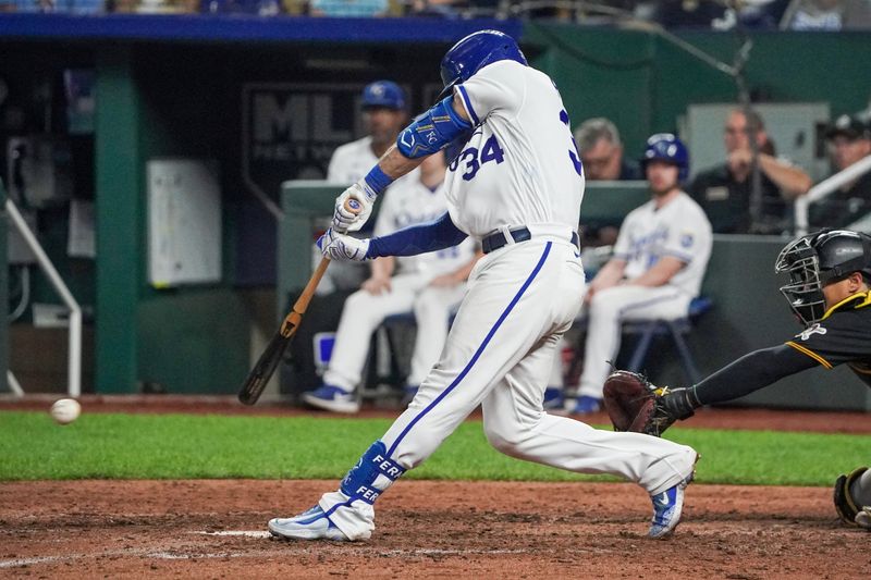 Aug 29, 2023; Kansas City, Missouri, USA; Kansas City Royals catcher Freddy Fermin (34) hits a one-run single against the Pittsburgh Pirates in the ninth inning at Kauffman Stadium. Mandatory Credit: Denny Medley-USA TODAY Sports