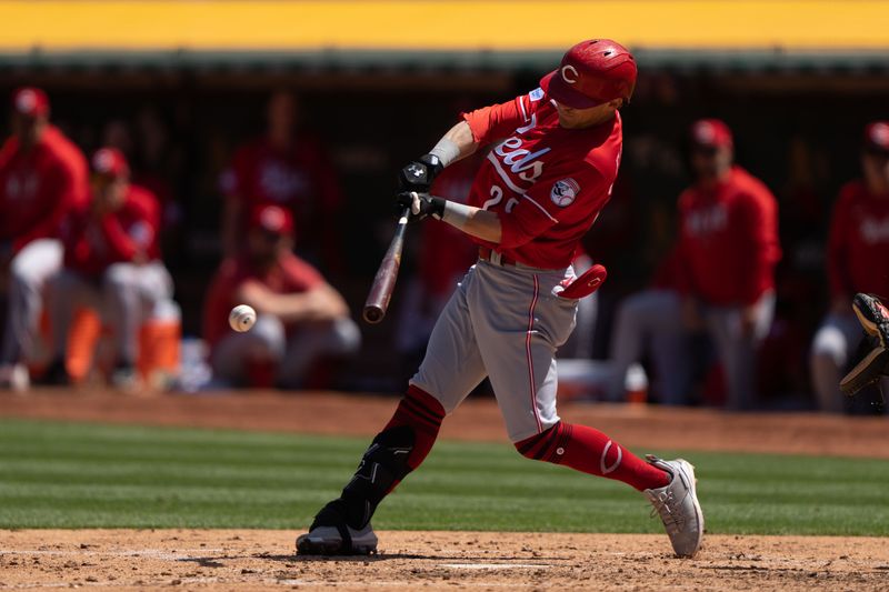 Apr 30, 2023; Oakland, California, USA; Cincinnati Reds center fielder TJ Friedl (29) hits a single during the sixth inning against the Oakland Athletics at RingCentral Coliseum. Mandatory Credit: Stan Szeto-USA TODAY Sports