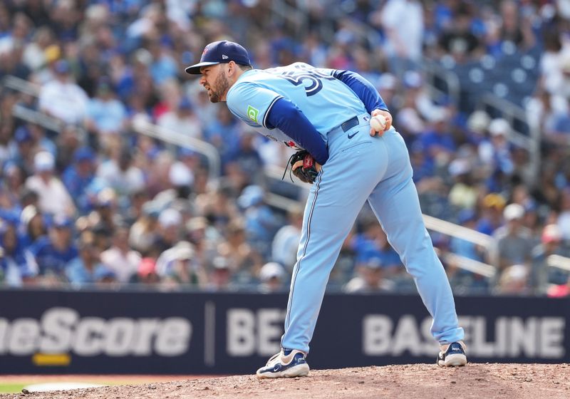 Aug 25, 2024; Toronto, Ontario, CAN; Toronto Blue Jays relief pitcher Zach Pop (56) gets ready to throw a pitch against the Los Angeles Angels during the ninth inning at Rogers Centre. Mandatory Credit: Nick Turchiaro-USA TODAY Sports