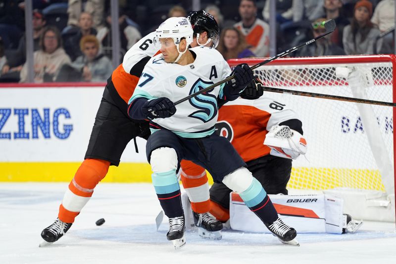 Oct 20, 2025; Philadelphia, Pennsylvania, USA; Seattle Kraken left wing Jaden Schwartz (17) battle for position against Philadelphia Flyers defenseman Travis Sanheim (6) in the first period at Xfinity Mobile Arena. Mandatory Credit: Kyle Ross-Imagn Images