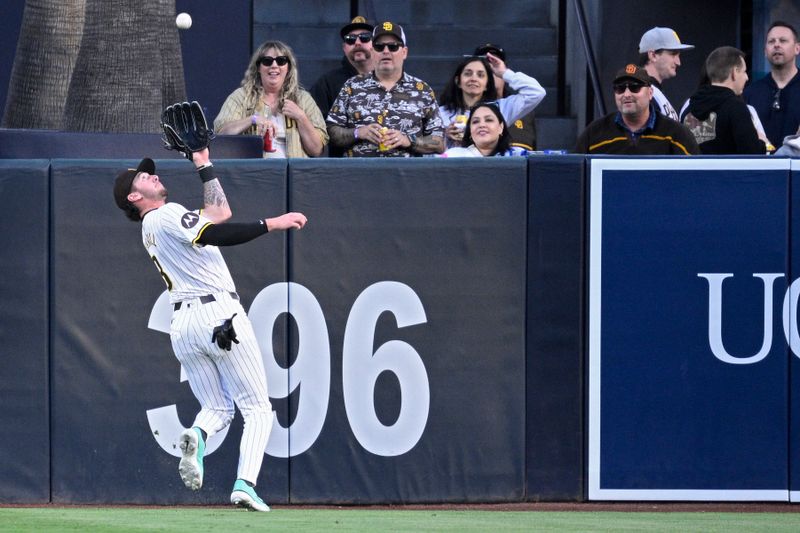 May 13, 2024; San Diego, California, USA; San Diego Padres center fielder Jackson Merrill (3) catches a fly ball hit by Colorado Rockies designated hitter Charlie Blackmon (not pictured) during the first inning at Petco Park. Mandatory Credit: Orlando Ramirez-USA TODAY Sports