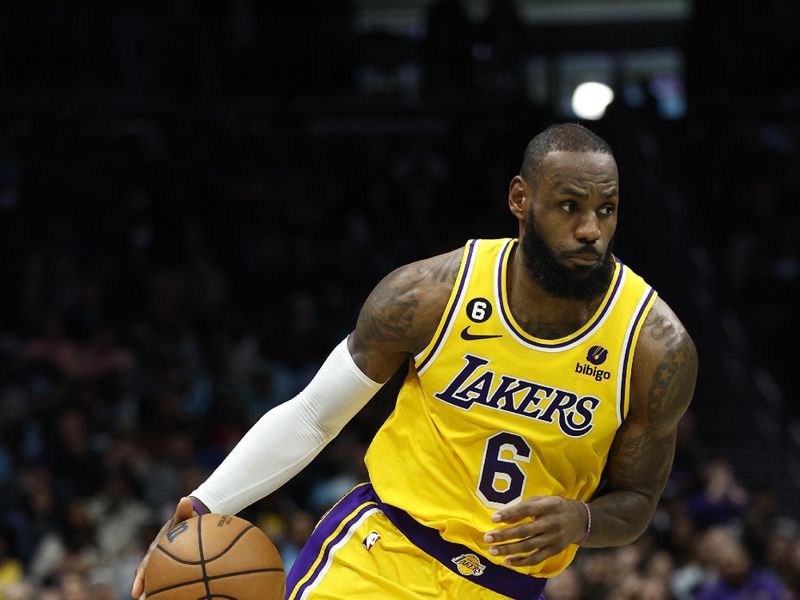 CHARLOTTE, NORTH CAROLINA - JANUARY 02: LeBron James #6 of the Los Angeles Lakers dribbles during the second half of the game against the Charlotte Hornets at Spectrum Center on January 02, 2023 in Charlotte, North Carolina. NOTE TO USER: User expressly acknowledges and agrees that, by downloading and or using this photograph, User is consenting to the terms and conditions of the Getty Images License Agreement. (Photo by Jared C. Tilton/Getty Images)