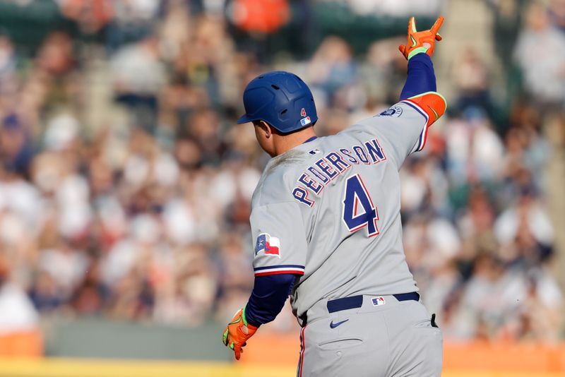 May 10, 2025; Detroit, Michigan, USA;  Texas Rangers designated hitter Joc Pederson (4) celebrates after he hits a two run home run in the third inning against the Detroit Tigers at Comerica Park. Mandatory Credit: Rick Osentoski-Imagn Images