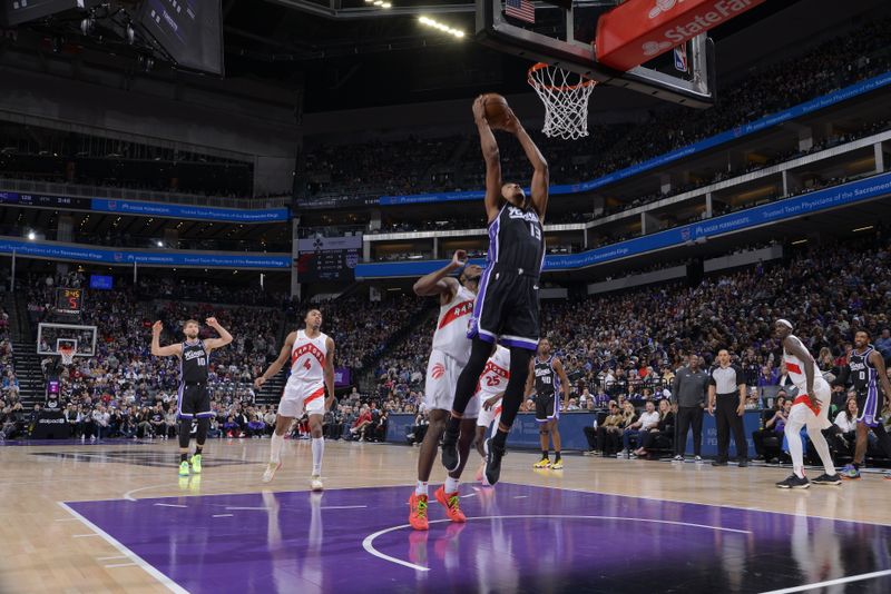 SACRAMENTO, CA - JANUARY 5: Keegan Murray #13 of the Sacramento Kings drives to the basket during the game against the Toronto Raptors on January 5, 2024 at Golden 1 Center in Sacramento, California. NOTE TO USER: User expressly acknowledges and agrees that, by downloading and or using this Photograph, user is consenting to the terms and conditions of the Getty Images License Agreement. Mandatory Copyright Notice: Copyright 2024 NBAE (Photo by Rocky Widner/NBAE via Getty Images)