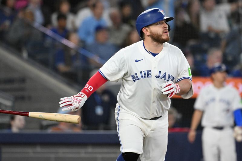 May 14, 2025; Toronto, Ontario, CAN;  Toronto Blue Jays catcher Alejandro Kirk (30) watches the flight of his three run home run against the Tampa Bay Rays in the sixth inning at Rogers Centre. Mandatory Credit: Dan Hamilton-Imagn Images