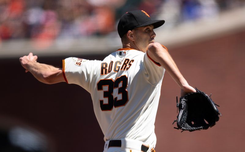 Jul 30, 2023; San Francisco, California, USA; San Francisco Giants pitcher Taylor Rogers (33) delivers a pitch against the Boston Red Sox during the seventh inning at Oracle Park. Mandatory Credit: D. Ross Cameron-USA TODAY Sports