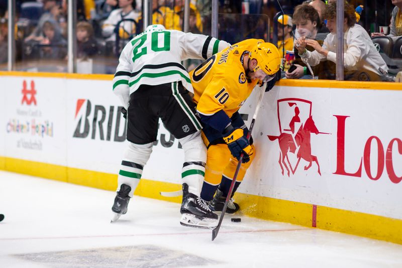 Feb 15, 2024; Nashville, Tennessee, USA; Dallas Stars defenseman Ryan Suter (20) and Nashville Predators center Colton Sissons (10) fight for the puck during the third period at Bridgestone Arena. Mandatory Credit: Steve Roberts-USA TODAY Sports