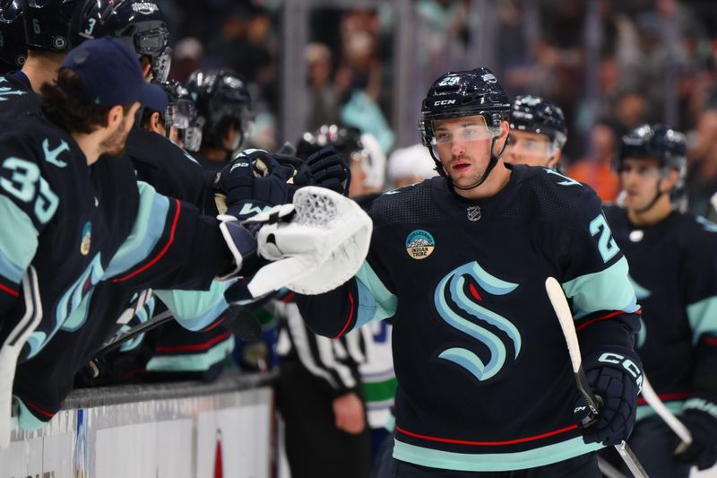 Feb 22, 2024; Seattle, Washington, USA; Seattle Kraken defenseman Vince Dunn (29) celebrates with the bench after scoring a goal against the Vancouver Canucks during the first period at Climate Pledge Arena. Mandatory Credit: Steven Bisig-USA TODAY Sports