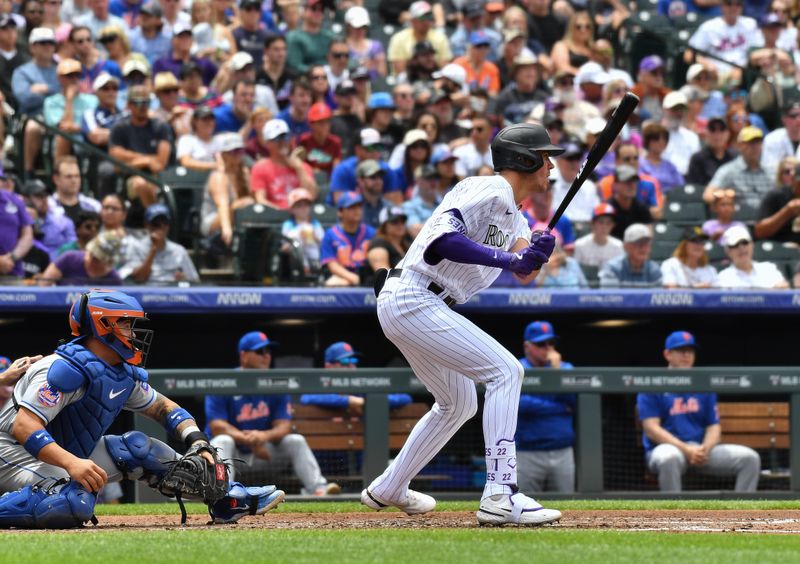 May 28, 2023; Denver, Colorado, USA; Colorado Rockies first baseman Nolan Jones (22) singles in the second inning against the New York Mets at Coors Field. Mandatory Credit: John Leyba-USA TODAY Sports