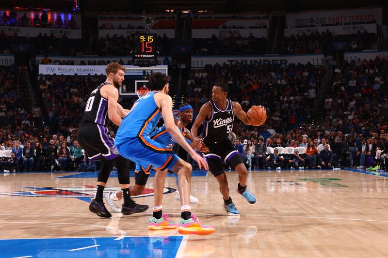 OKLAHOMA CITY, OK - APRIL 9:  De'Aaron Fox #5 of the Sacramento Kings dribbles the ball during the game against the Oklahoma City Thunder on April 9, 2024 at Paycom Arena in Oklahoma City, Oklahoma. NOTE TO USER: User expressly acknowledges and agrees that, by downloading and or using this photograph, User is consenting to the terms and conditions of the Getty Images License Agreement. Mandatory Copyright Notice: Copyright 2024 NBAE (Photo by Zach Beeker/NBAE via Getty Images)