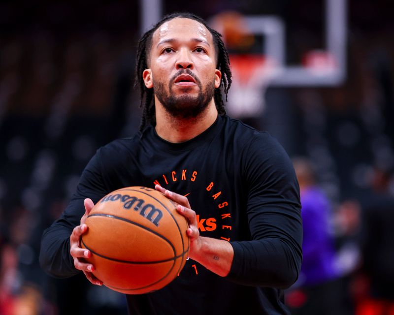 TORONTO, CANADA - DECEMBER 9: Jalen Brunson #11 of the New York Knicks warms up before the game against the Toronto Raptors on December 9, 2024 at the Scotiabank Arena in Toronto, Ontario, Canada.  NOTE TO USER: User expressly acknowledges and agrees that, by downloading and or using this Photograph, user is consenting to the terms and conditions of the Getty Images License Agreement.  Mandatory Copyright Notice: Copyright 2024 NBAE (Photo by Vaughn Ridley/NBAE via Getty Images)