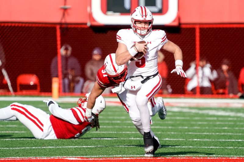 Nov 19, 2022; Lincoln, Nebraska, USA; Wisconsin Badgers quarterback Graham Mertz (5) runs with the ball against the Nebraska Cornhuskers during the fourth quarter at Memorial Stadium. Mandatory Credit: Dylan Widger-USA TODAY Sports