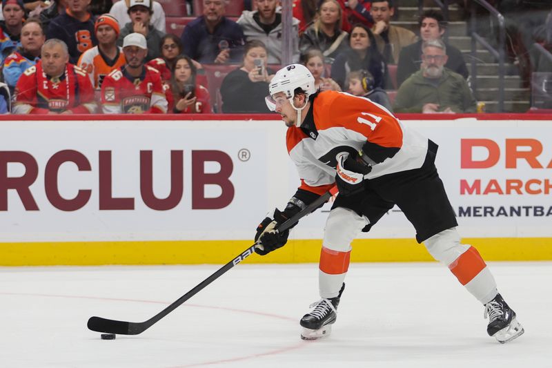 Feb 6, 2024; Sunrise, Florida, USA; Philadelphia Flyers right wing Travis Konecny (11) moves the puck against the Florida Panthers during the first period at Amerant Bank Arena. Mandatory Credit: Sam Navarro-USA TODAY Sports