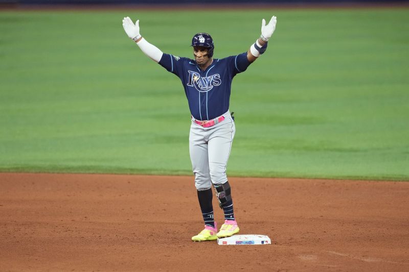 Aug 30, 2023; Miami, Florida, USA; Tampa Bay Rays first baseman Yandy Diaz (2) celebrates a double in the sixth inning against the Miami Marlins at loanDepot Park. Mandatory Credit: Jim Rassol-USA TODAY Sports