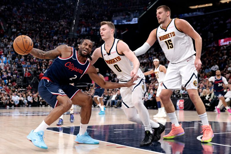 INGLEWOOD, CALIFORNIA - APRIL 24: Kawhi Leonard #2 of the Los Angeles Clippers dribbles the ball against Christian Braun #0 and Nikola Jokic #15 of the Denver Nuggets during the second quarter in Game Three of the Western Conference First Round NBA Playoffs at Intuit Dome on April 24, 2025 in Inglewood, California. NOTE TO USER: User expressly acknowledges and agrees that, by downloading and or using this photograph, User is consenting to the terms and conditions of the Getty Images License Agreement. (Photo by Ronald Martinez/Getty Images)