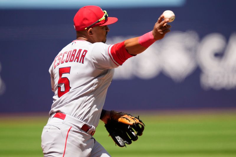 Jul 30, 2023; Toronto, Ontario, CAN; Los Angeles Angels third baseman Eduardo Escobar (5) throws out Toronto Blue Jays left fielder Whit Merrifield (not pictured) during the seventh inning at Rogers Centre. Mandatory Credit: John E. Sokolowski-USA TODAY Sports