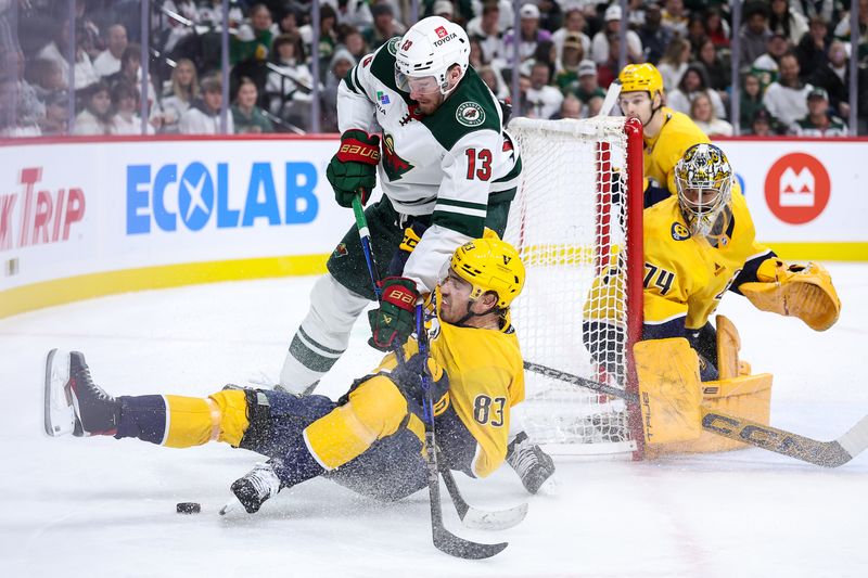 Nov 30, 2024; Saint Paul, Minnesota, USA; Minnesota Wild center Yakov Trenin (13) checks Nashville Predators defenseman Adam Wilsby (83) during the second period at Xcel Energy Center. Mandatory Credit: Matt Krohn-Imagn Images