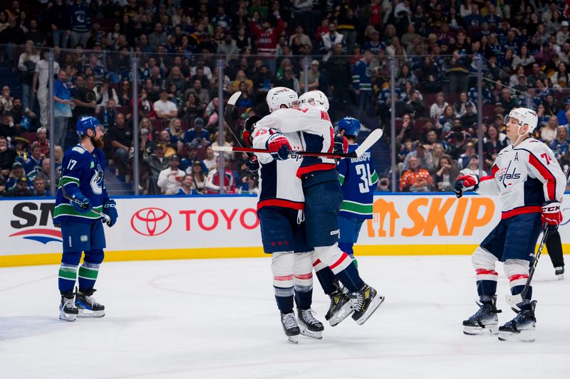 Mar 16, 2024; Vancouver, British Columbia, CAN; Washington Capitals forward Tom Wilson (43) and forward Ivan Miroshnichenko (63) and defenseman John Carlson (74) celebrate Wilson’s goal against the Vancouver Canucks in the second period at Rogers Arena. Mandatory Credit: Bob Frid-USA TODAY Sports