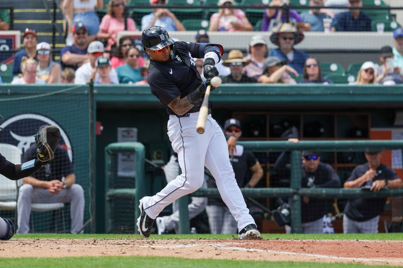 Mar 23, 2024; Lakeland, Florida, USA; Detroit Tigers shortstop Javier Baez (28) doubles in the third against the New York Yankees at Publix Field at Joker Marchant Stadium. Mandatory Credit: Mike Watters-USA TODAY Sports