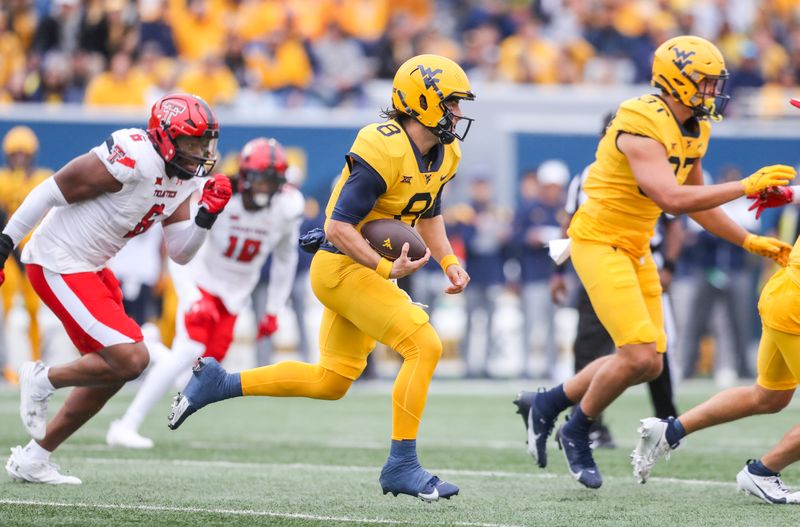 Sep 23, 2023; Morgantown, West Virginia, USA; West Virginia Mountaineers quarterback Nicco Marchiol (8) runs the ball during the first quarter against the Texas Tech Red Raiders at Mountaineer Field at Milan Puskar Stadium. Mandatory Credit: Ben Queen-USA TODAY Sports