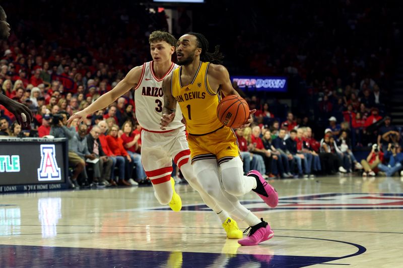 Feb 17, 2024; Tucson, Arizona, USA; Arizona State Sun Devils guard Frankie Collins (1) drives to the net against Arizona Wildcats guard Pelle Larsson (3) during the first half at McKale Center. Mandatory Credit: Zachary BonDurant-USA TODAY Sports