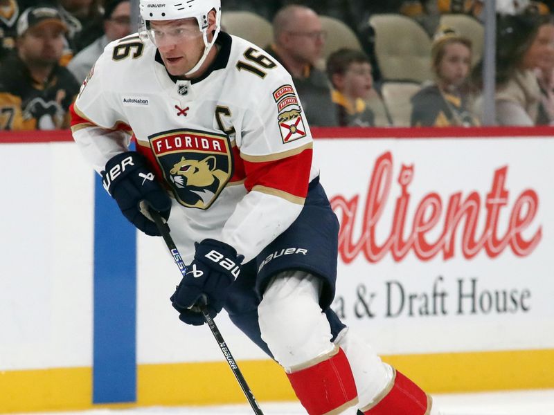 Dec 3, 2024; Pittsburgh, Pennsylvania, USA;  Florida Panthers center Aleksander Barkov (16) moves the puck up ice against the Pittsburgh Penguins during the second period at PPG Paints Arena. Mandatory Credit: Charles LeClaire-Imagn Images