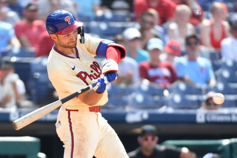 Jun 30, 2024; Philadelphia, Pennsylvania, USA; Philadelphia Phillies shortstop Trea Turner (7) hits a two RBI double against the Miami Marlins during the seventh inning at Citizens Bank Park. Mandatory Credit: Eric Hartline-USA TODAY Sports