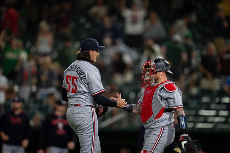 Jun 2, 2025; West Sacramento, California, USA; Minnesota Twins pitcher Kody Funderburk (55) and Minnesota Twins catcher Christian Vázquez (8) celebrate after the game against the Athletics at Sutter Health Park. Mandatory Credit: Neville E. Guard-Imagn Images