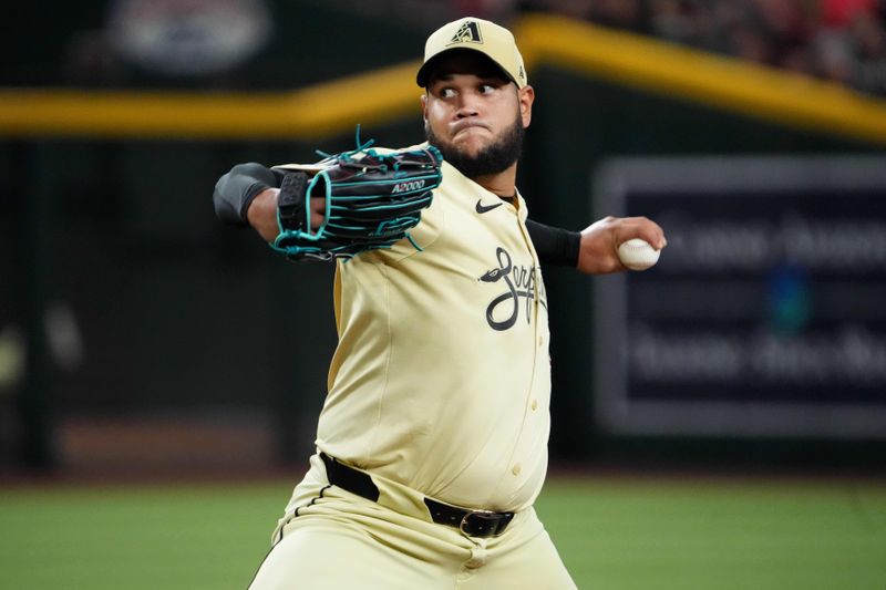 Aug 13, 2024; Phoenix, Arizona, USA; Arizona Diamondbacks pitcher Eduardo Rodriguez (57) pitches against the Colorado Rockies during the first inning at Chase Field. Mandatory Credit: Joe Camporeale-USA TODAY Sports