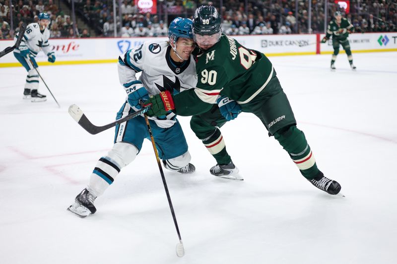 Oct 26, 2025; Saint Paul, Minnesota, USA; San Jose Sharks left wing William Eklund (72) and Minnesota Wild left wing Marcus Johansson (90) compete for the puck during the first period at Grand Casino Arena. Mandatory Credit: Matt Krohn-Imagn Images