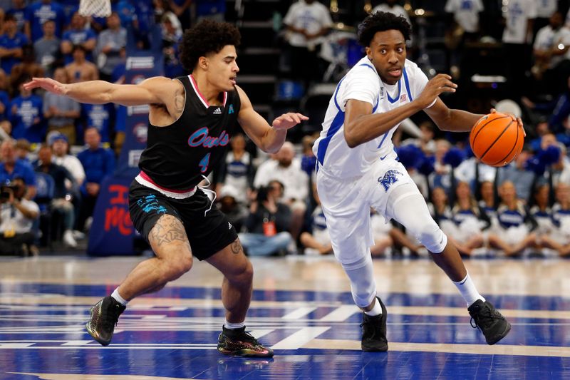 Feb 25, 2024; Memphis, Tennessee, USA; Memphis Tigers forward Nae'Qwan Tomlin (7) dribbles as Florida Atlantic Owls guard Bryan Greenlee (4) defends during the first half at FedExForum. Mandatory Credit: Petre Thomas-USA TODAY Sports