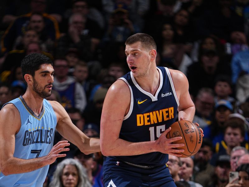 DENVER, CO - MARCH 25: Nikola Jokic #15 of the Denver Nuggets handles the ball during the game against the Memphis Grizzlies on March 25, 2024 at the Ball Arena in Denver, Colorado. NOTE TO USER: User expressly acknowledges and agrees that, by downloading and/or using this Photograph, user is consenting to the terms and conditions of the Getty Images License Agreement. Mandatory Copyright Notice: Copyright 2024 NBAE (Photo by Garrett Ellwood/NBAE via Getty Images)