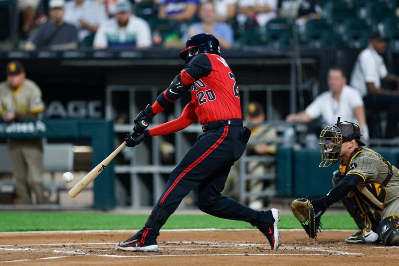 Sep 19, 2025; Chicago, Illinois, USA; Chicago White Sox first baseman Miguel Vargas (20) hits a two-run home run against the San Diego Padres during the first inning at Rate Field. Mandatory Credit: Kamil Krzaczynski-Imagn Images