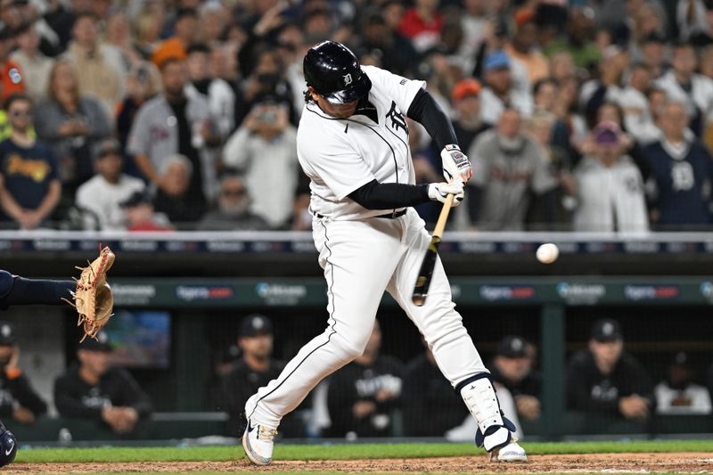 Sep 29, 2023; Detroit, Michigan, USA; Detroit Tigers designated hitter Miguel Cabrera (24) hits a single against the Cleveland Guardians in the seventh inning at Comerica Park. Mandatory Credit: Lon Horwedel-USA TODAY Sports