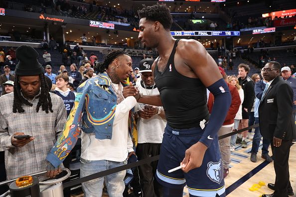 MEMPHIS, TN - DECEMBER 21: Jaren Jackson Jr. #13 of the Memphis Grizzlies embraces Moneybagg Yo after giving him his jersey after the game against the Indiana Pacers on December 21, 2023 at FedExForum in Memphis, Tennessee. NOTE TO USER: User expressly acknowledges and agrees that, by downloading and or using this photograph, User is consenting to the terms and conditions of the Getty Images License Agreement. Mandatory Copyright Notice: Copyright 2023 NBAE (Photo by Joe Murphy/NBAE via Getty Images)