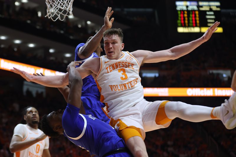 Mar 9, 2024; Knoxville, Tennessee, USA; Tennessee Volunteers guard Dalton Knecht (3) is fouled by the Kentucky Wildcats during the second half at Thompson-Boling Arena at Food City Center. Mandatory Credit: Randy Sartin-USA TODAY Sports