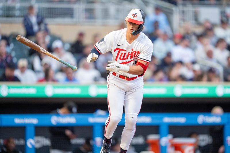 Apr 23, 2025; Minneapolis, Minnesota, USA; Minnesota Twins second base Luke Keaschall (15) walks on pitches from Chicago White Sox right fielder Joshua Palacios (47) in the third inning at Target Field. Mandatory Credit: Matt Blewett-Imagn Images