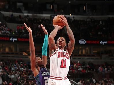 CHICAGO, IL - DECEMBER 6: DeMar DeRozan #11 of the Chicago Bulls shoots the ball during the game against the Charlotte Hornets on December 6, 2023 at the United Center in Chicago, Illinois. NOTE TO USER: User expressly acknowledges and agrees that, by downloading and or using this Photograph, user is consenting to the terms and conditions of the Getty Images License Agreement. Mandatory Copyright Notice: Copyright 2023 NBAE (Photo by Gary Dineen/NBAE via Getty Images).