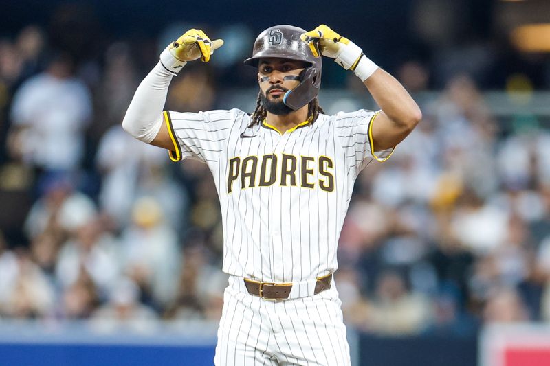 May 17, 2025; San Diego, California, USA; San Diego Padres right fielder Fernando Tatis Jr. (23) celebrates with the dugout after hitting a double during the fifth inning against the Seattle Mariners at Petco Park. Mandatory Credit: David Frerker-Imagn Images