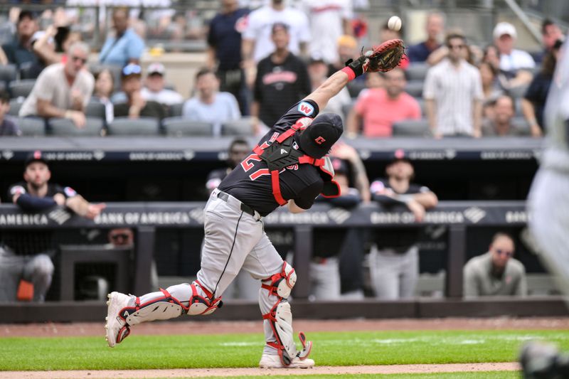 Aug 22, 2024; Bronx, New York, USA; Cleveland Guardians catcher Austin Hedges (27) catches a pop fly for an out against the New York Yankees during the seventh inning at Yankee Stadium. Mandatory Credit: John Jones-USA TODAY Sports