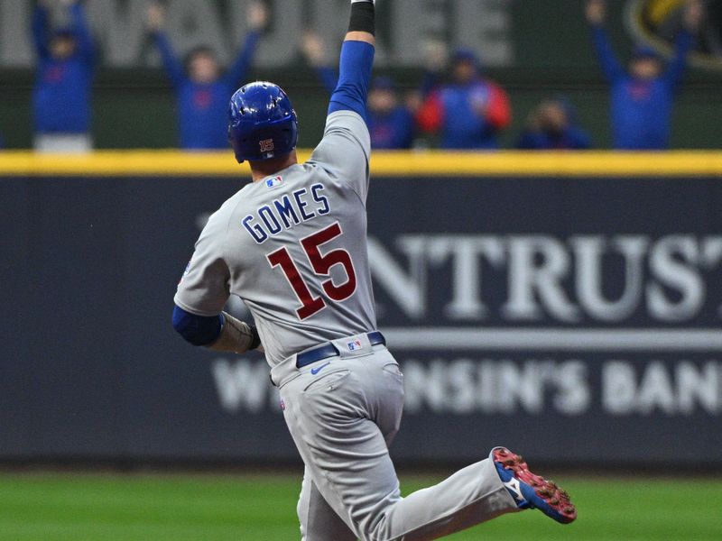 Sep 30, 2023; Milwaukee, Wisconsin, USA; Chicago Cubs catcher Yan Gomes (15) celebrates with the Chicago Cubs bullpen as he rounds the bases after hitting a home run against the Milwaukee Brewers in the first inning at American Family Field. Mandatory Credit: Michael McLoone-USA TODAY Sports