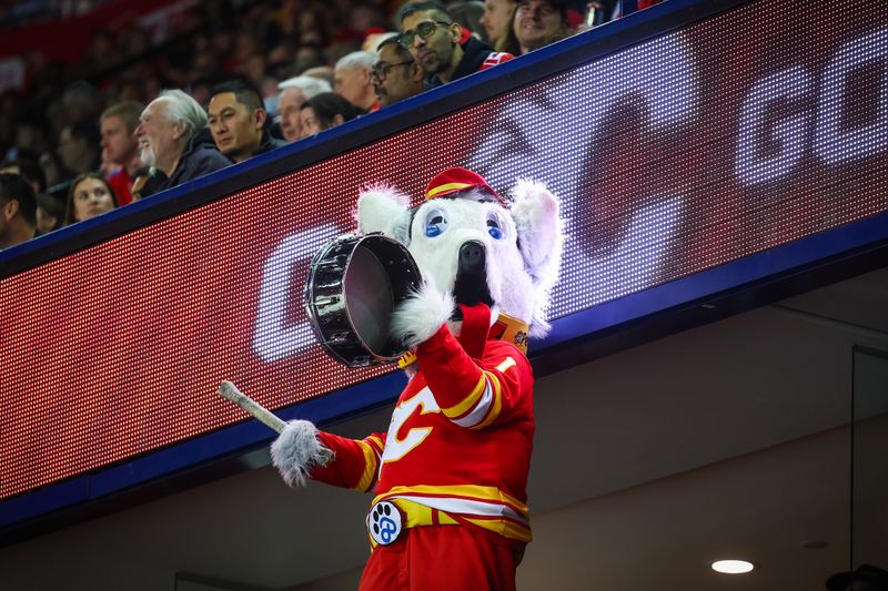 Nov 15, 2024; Calgary, Alberta, CAN; Calgary Flames mascot Harvey the Hound during the first period between the Calgary Flames and the Nashville Predators at Scotiabank Saddledome. Mandatory Credit: Sergei Belski-Imagn Images