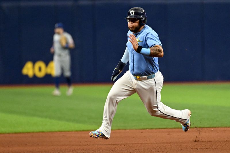 May 26, 2024; St. Petersburg, Florida, USA; Tampa Bay Rays designated hitter Harold Ramirez (43) heads for third base in the seventh inning against the Kansas City Royals at Tropicana Field. Mandatory Credit: Jonathan Dyer-USA TODAY Sports