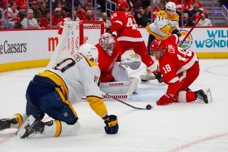 Dec 29, 2023; Detroit, Michigan, USA; Nashville Predators center Colton Sissons (10) attempts to gain control of the puck during the first of the game between the Nashville Predators and the Detroit Red Wings at Little Caesars Arena. Mandatory Credit: Brian Bradshaw Sevald-USA TODAY Sports