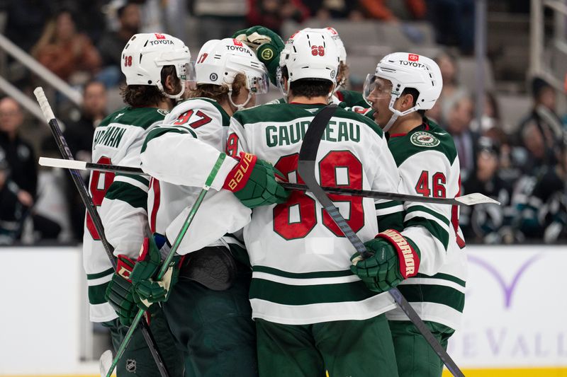 Nov 7, 2024; San Jose, California, USA;  Minnesota Wild celebrate after scoring a goal against the San Jose Sharks during the third period at SAP Center at San Jose. Mandatory Credit: Stan Szeto-Imagn Images