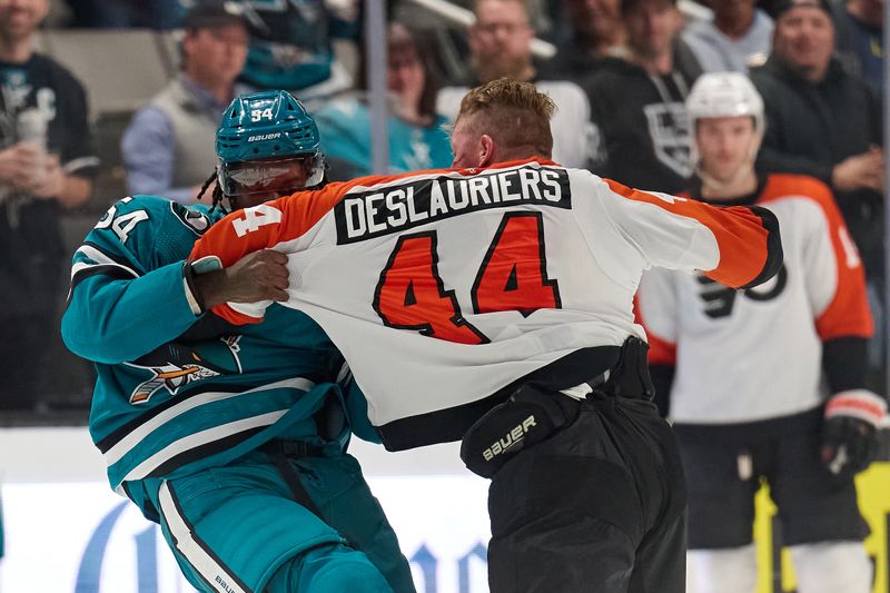 Nov 7, 2023; San Jose, California, USA; Philadelphia Flyers left wing Nicolas Deslauriers (44) fights with San Jose Sharks right wing Givani Smith (54) during the first period at SAP Center at San Jose. Mandatory Credit: Robert Edwards-USA TODAY Sports