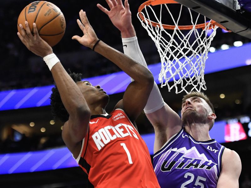 SALT LAKE CITY, UTAH - MARCH 29: Amen Thompson #1 of the Houston Rockets shoots over Micah Potter #25 of the Utah Jazz during the first half of a game at Delta Center on March 29, 2024 in Salt Lake City, Utah. NOTE TO USER: User expressly acknowledges and agrees that, by downloading and or using this photograph, User is consenting to the terms and conditions of the Getty Images License Agreement.  (Photo by Alex Goodlett/Getty Images)