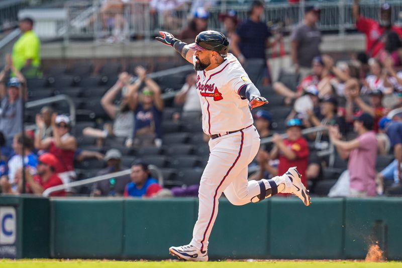 Sep 14, 2025; Cumberland, Georgia, USA; Atlanta Braves catcher Sandy Leon (8) reacts after hitting a home run against the Houston Astros during the seventh inning at Truist Park. Mandatory Credit: Dale Zanine-Imagn Images