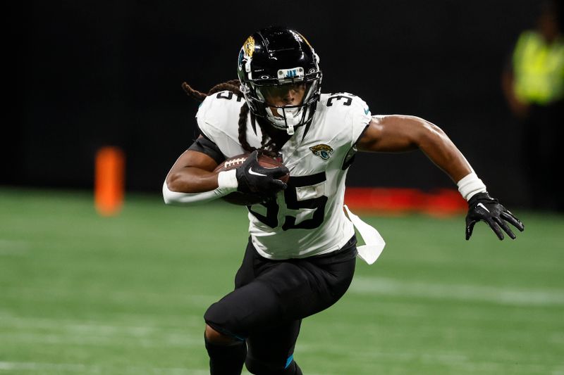 Jacksonville Jaguars tight end Brenton Strange (85) runs against the Atlanta Falcons in the second half of an NFL preseason footballl game, Friday, Aug. 23, 2024, in Atlanta. (AP Photo/Butch Dill)