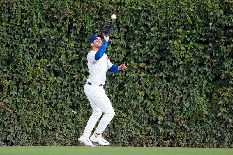 Sep 21, 2023; Chicago, Illinois, USA; Chicago Cubs center fielder Mike Tauchman (40) catches a ball against the Pittsburgh Pirates during the first inning at Wrigley Field. Mandatory Credit: David Banks-USA TODAY Sports